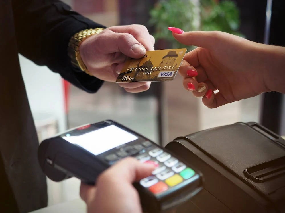A person paying using a credit card